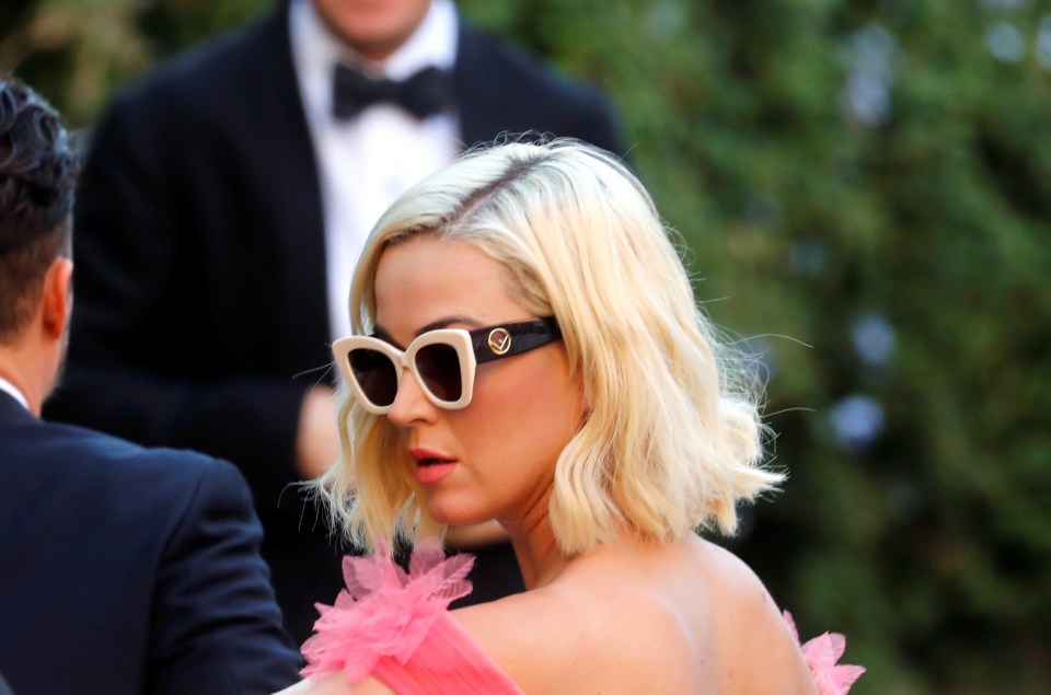 The pop star finished her look with some chic white sunnies