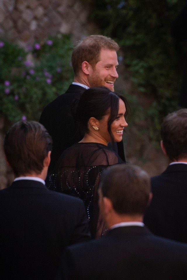 Meghan paired the golden feather earrings with a £9,000 Valentino couture sequinned dress