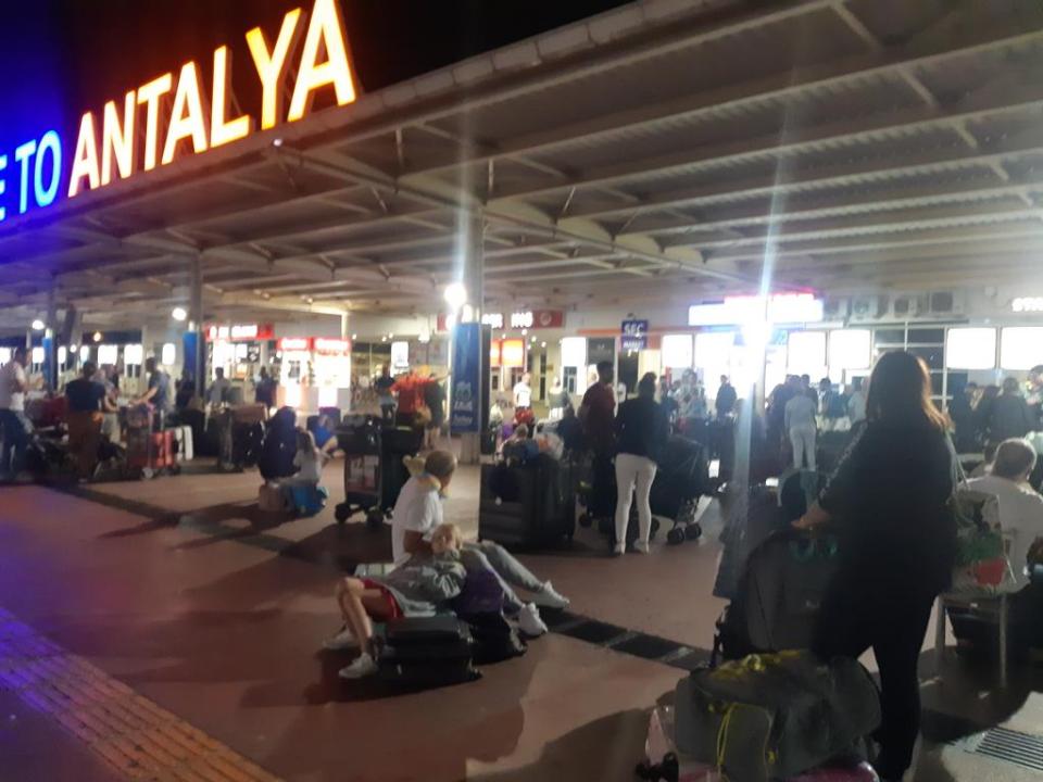  Dozens of passengers resting on their suitcases in Turkey after the jet engine broke down