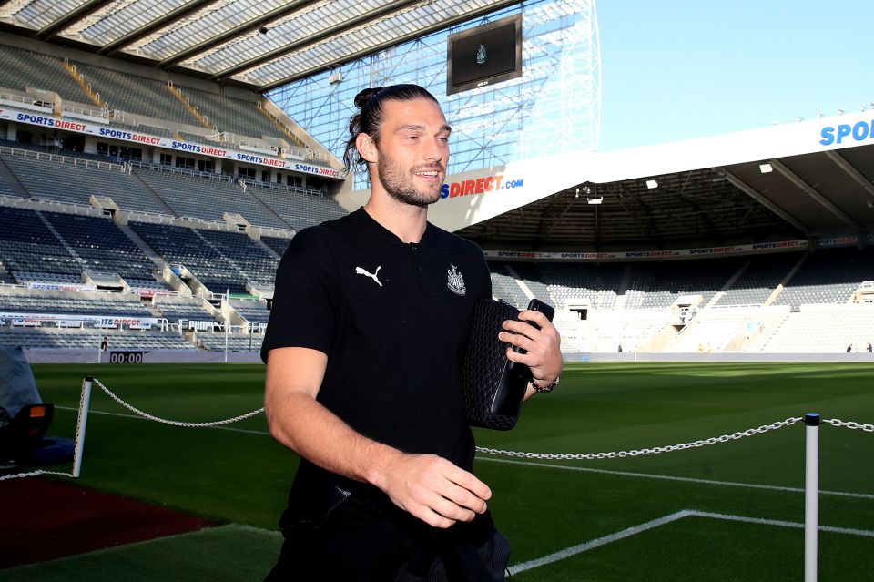  Andy Carroll beams with happiness as he arrives for the game against Brighton