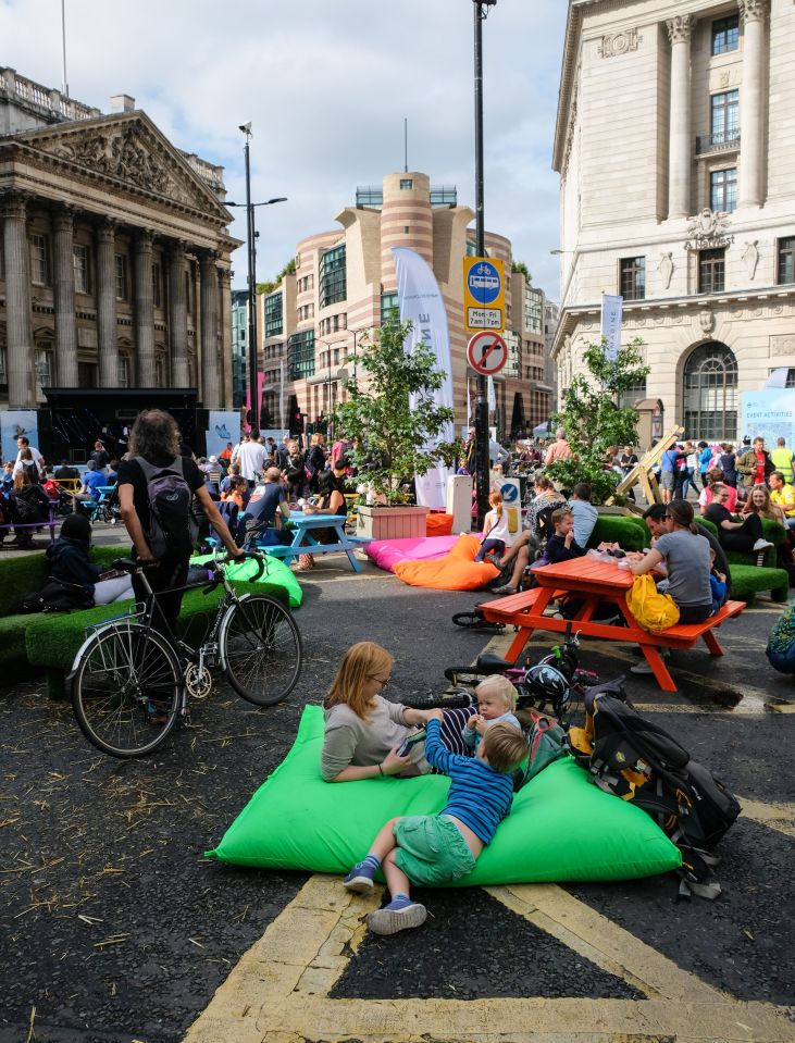  A couple of kids have some fun on bean bags outside Bank tube station