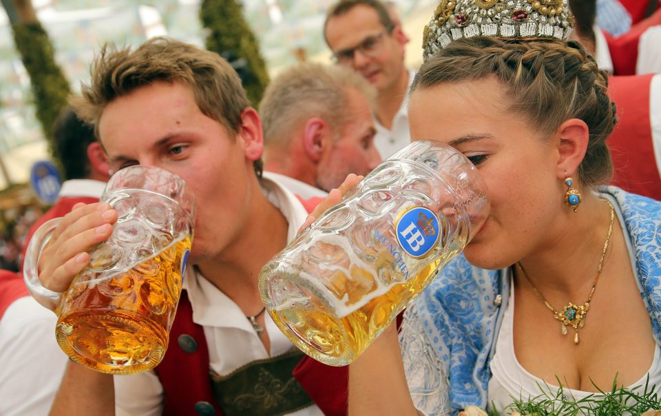  A couple down a pint of refreshing beer in the Hofbrau beer tent