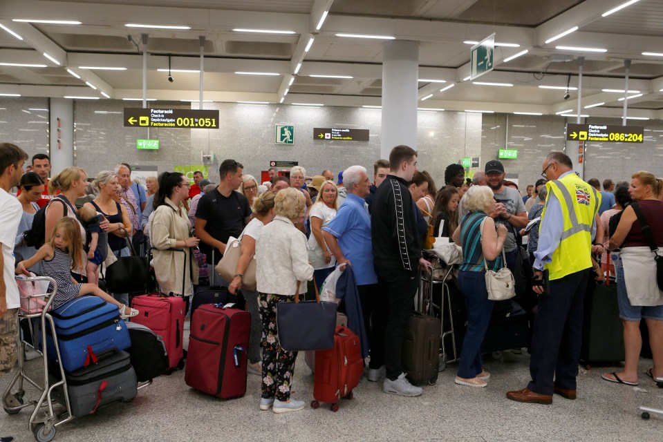 There were chaotic scenes at Thomas Cook check-in points at Majorca Airport this morning