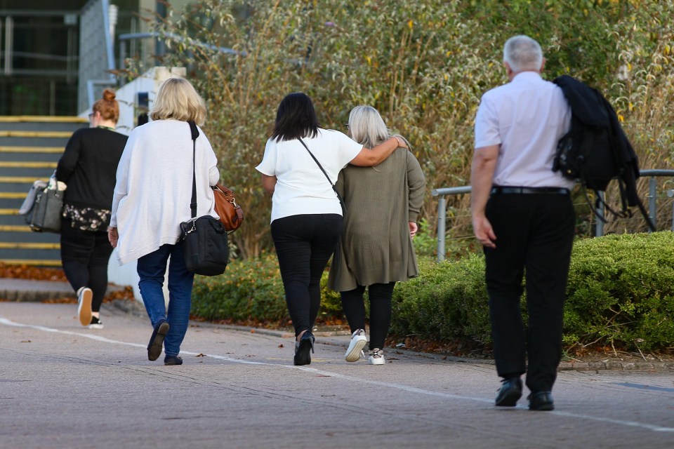 Thomas Cook staff arrive the firm’s HQ this morning after news of the company’s collapse