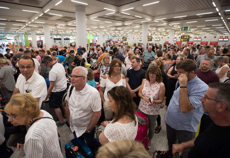 Hundreds of holidaymakers queue at Son Sant Joan airport in Palma de Mallorca after Thomas Cook collapsed 