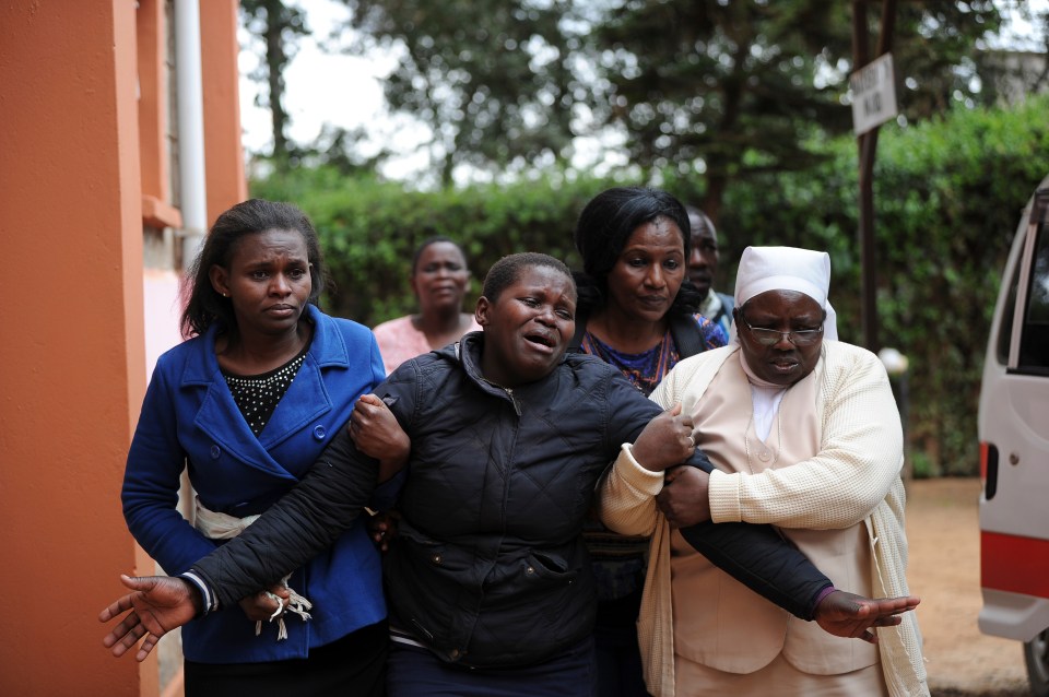  Medics comfort a mother who lost her child