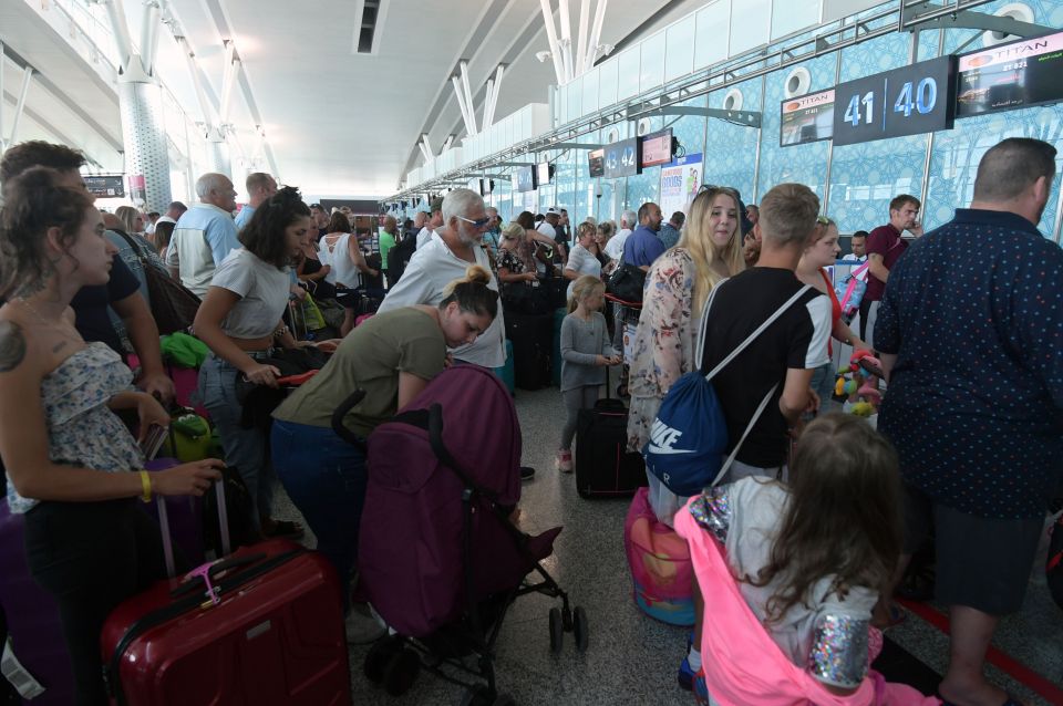  British tourists, flying with Thomas Cook, queue at the Enfidha International airport