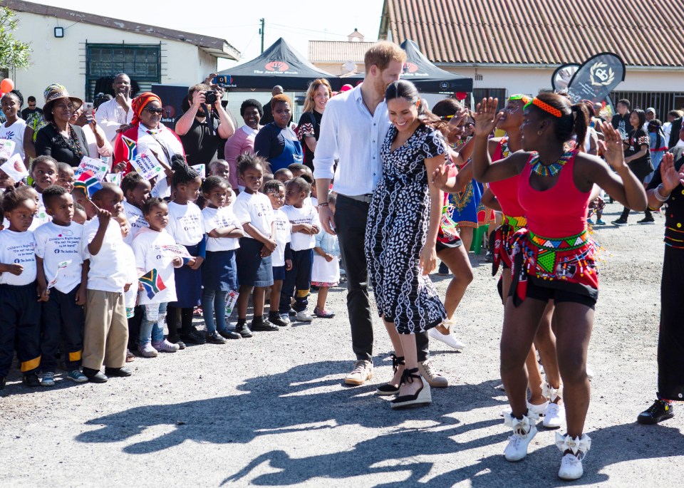 He was also seen pulling the Duchess close as they kicked off their ten-day tour