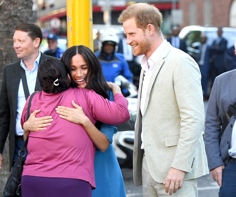  Meghan beamed and appeared to enjoy the hug