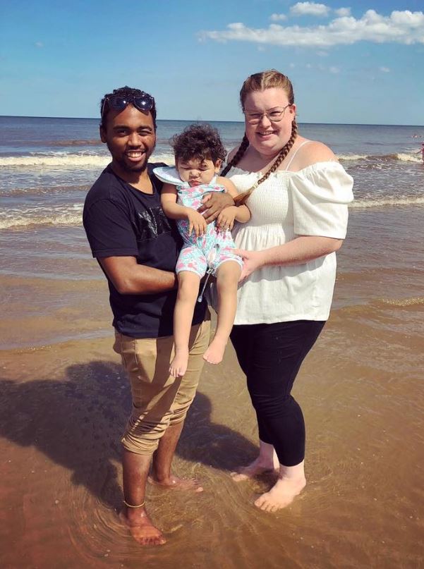  Demine Warner and her partner Lance Coericius holding Aubree