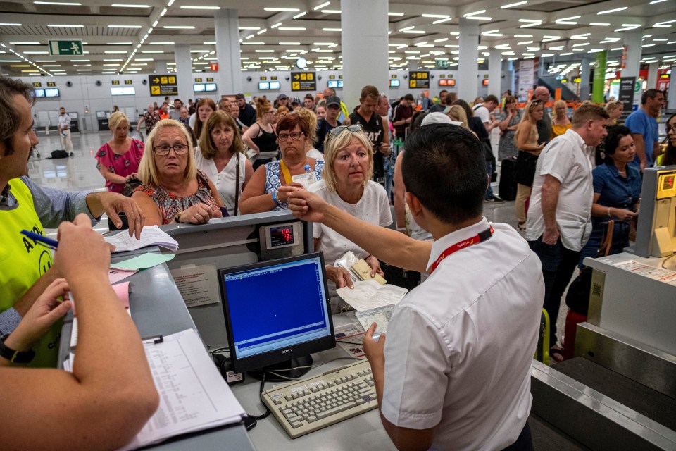  Passengers wait to be helped at Palma airport after Thomas Cook airline canceling their flights, in Palma, Balearic Islands, Spain