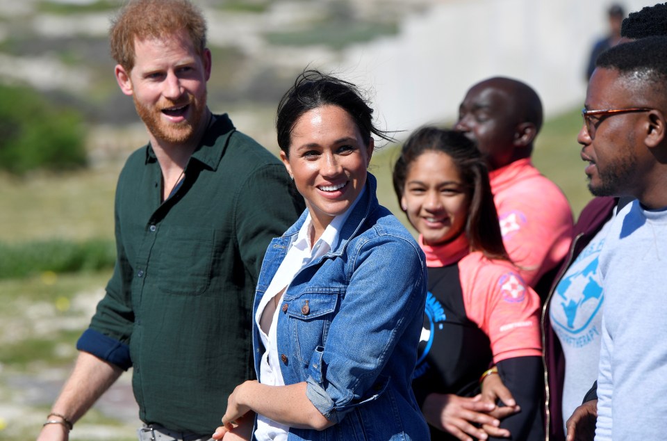  The couple continue to hold hands after a body language expert revealed they were still in the honeymoon phase