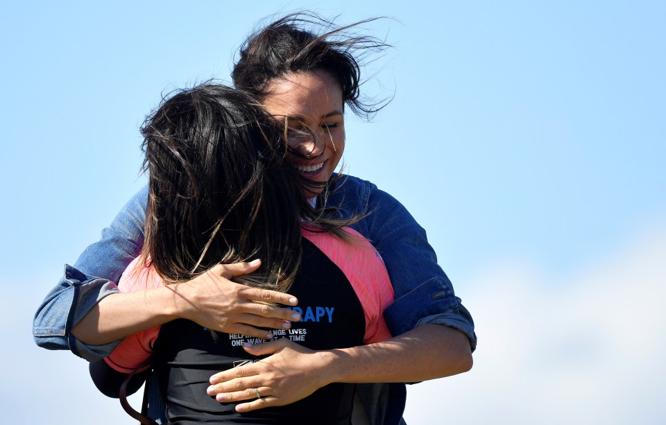  Meghan Markle doled out the hugs during the visit today