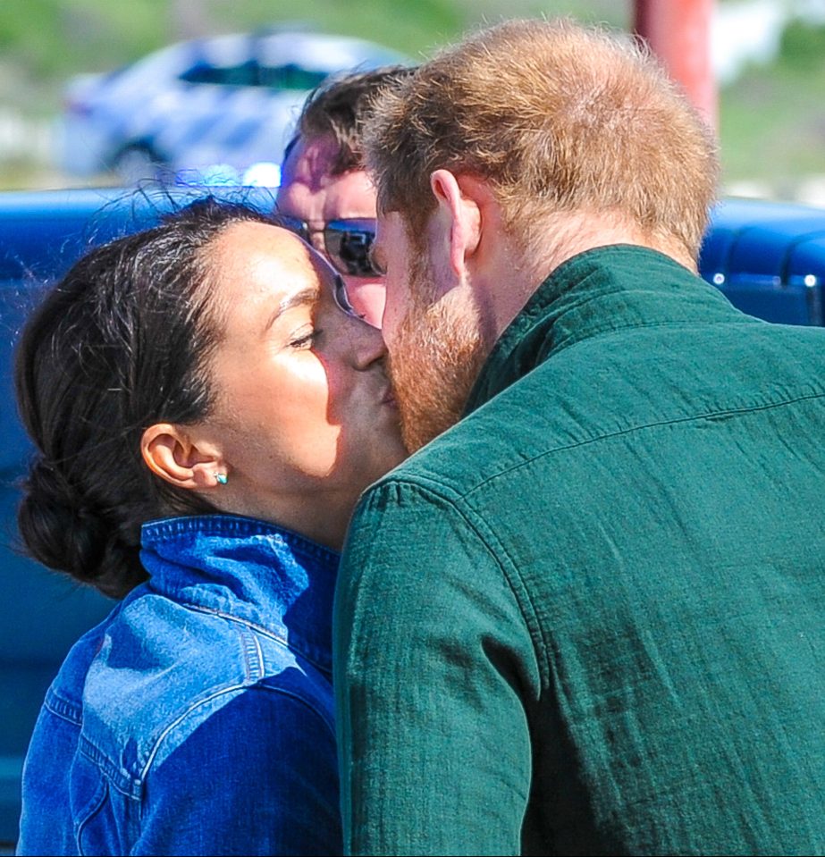 The couple looked loved-up as Harry gave Meghan a kiss