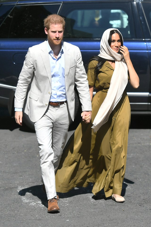  The duchess held hands with Prince Harry as they arrived for another engagement today