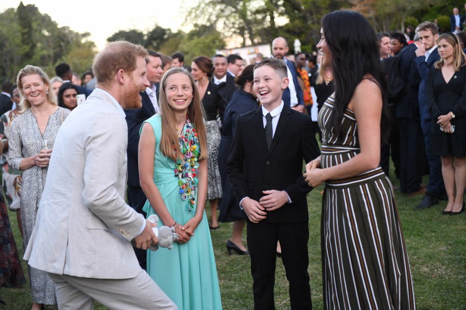  Harry appeared to be in fine form as the couple joked with kids at the event