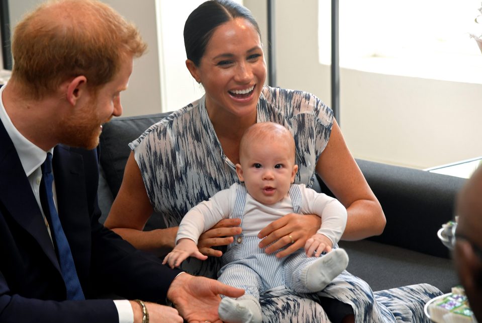  Archie stole the show on the third day of the royal tour, wearing a sweet blue romper as he's carried by Meghan Markle