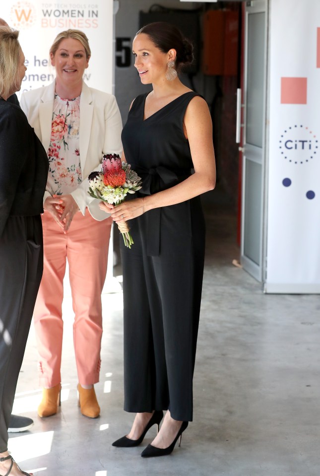  Meghan was handed some flowers as she arrived for her solo engagement