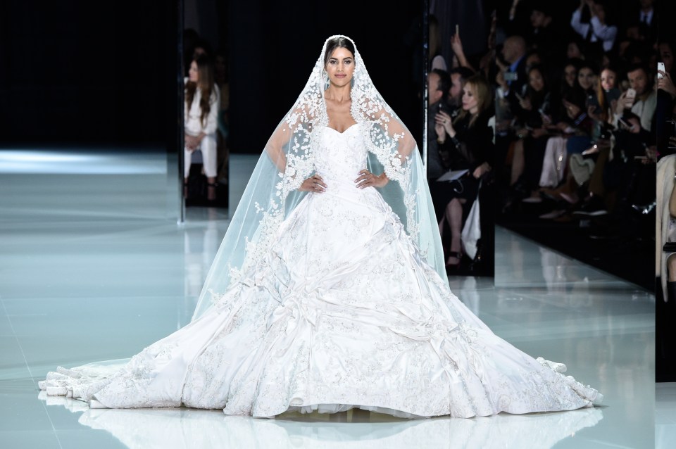 Ralph & Russo has also been named as a possible choice