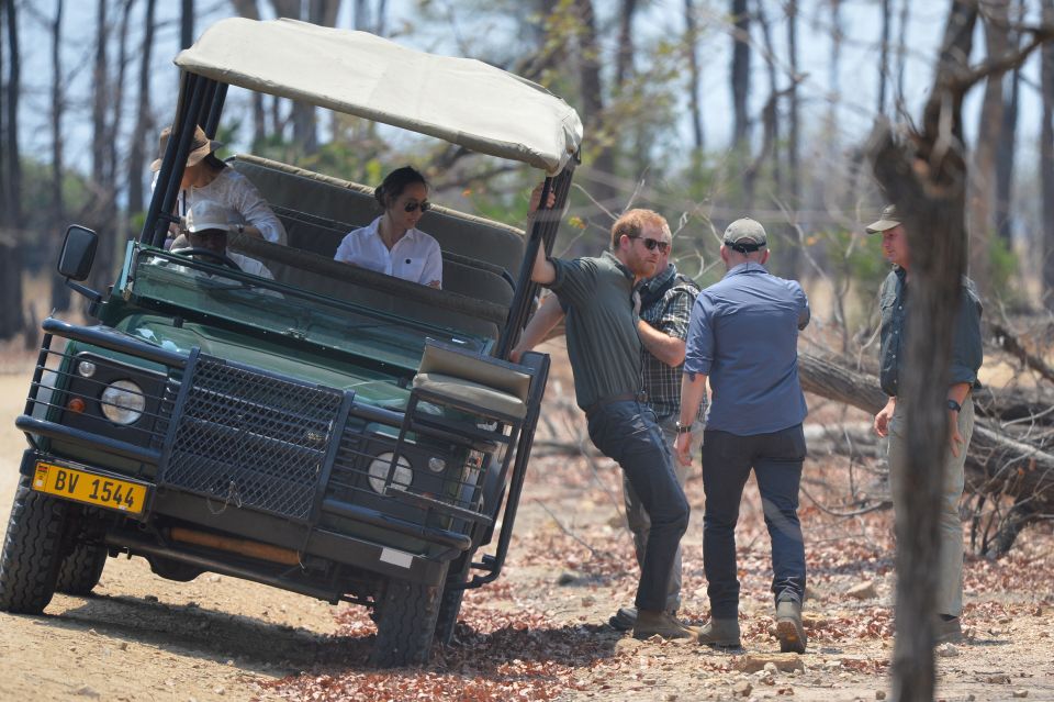  Later on he was pictured leaning against a Land Rover speaking with local rangers