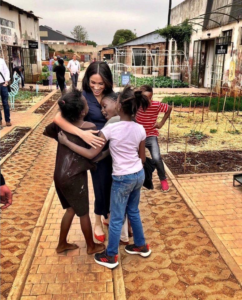  Meghan Markle receives a warm welcome from a group of children