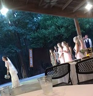 A bride tossed her bouquet up in the air during her wedding reception