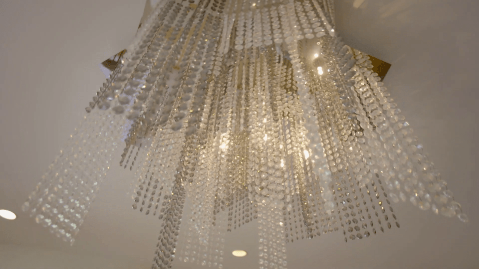 The house comes complete with a glittering chandelier