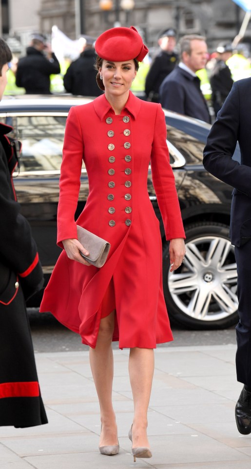  A military-inspired red Catheriine Walker coat, perfectly styled with a pillbox hat and beige suede accessories, puts Kate centre stage at the Commonwealth Day service