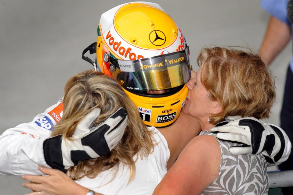  Hamilton hugged mum Carmen and step-mum Linda en route to his first F1 crown