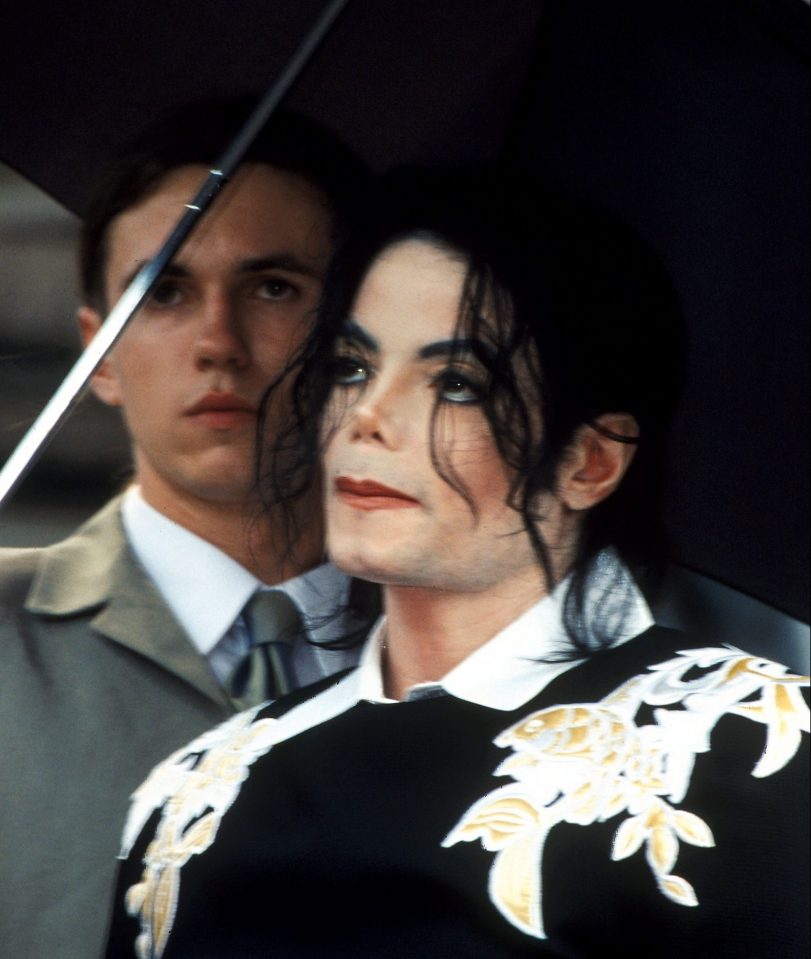  Fiddes holds an umbrella for Jacko during his time working for the star