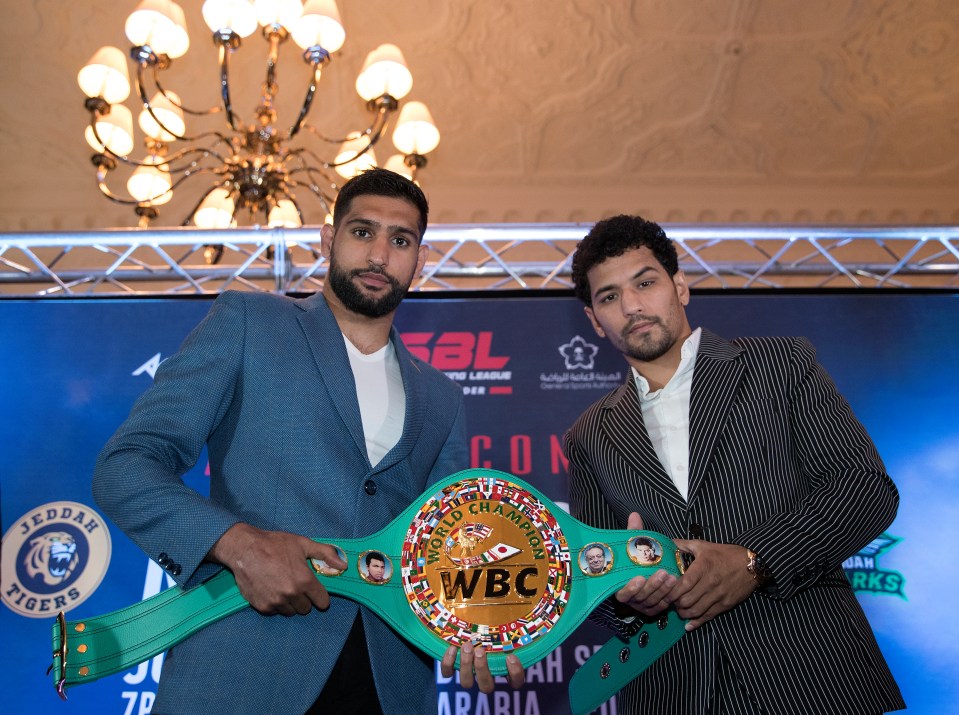 Neeraj Goyat, right, had to pull out of his fight against Amir Khan after being injured in a car crash