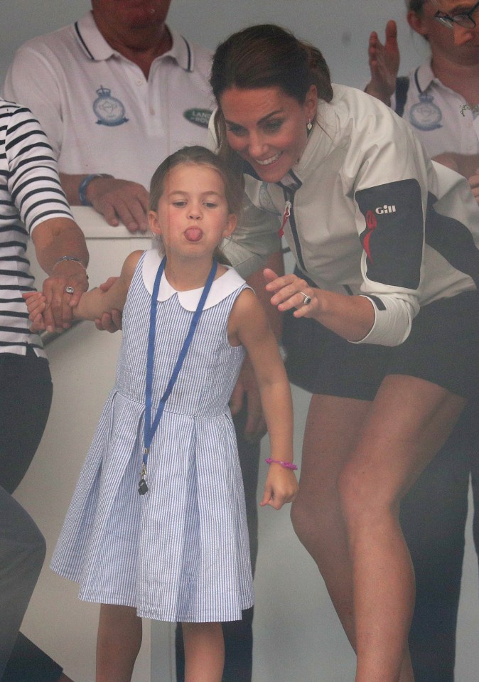  Kate grins as her cheeky daughter sticks out her tongue