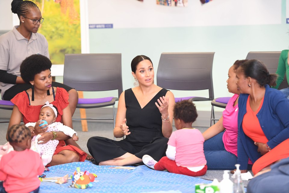  Meghan chatting with mothers at a not-for-profit organisation with the vision of a healthy, HIV-free Africa