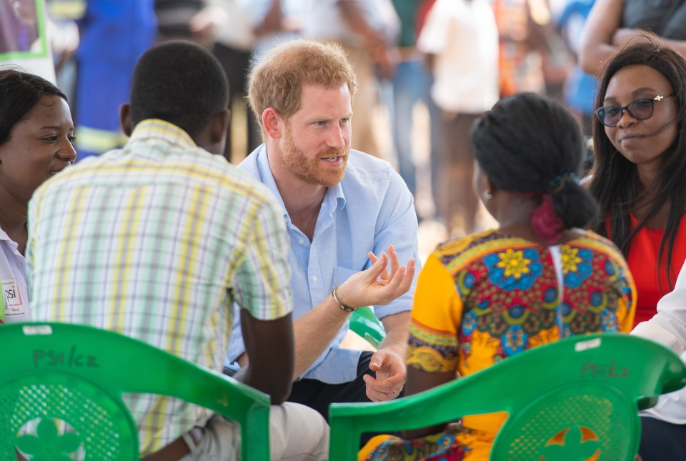  Harry talking with young people during a visit to the Mauwa Health Centre in Blantyre, Malawi,