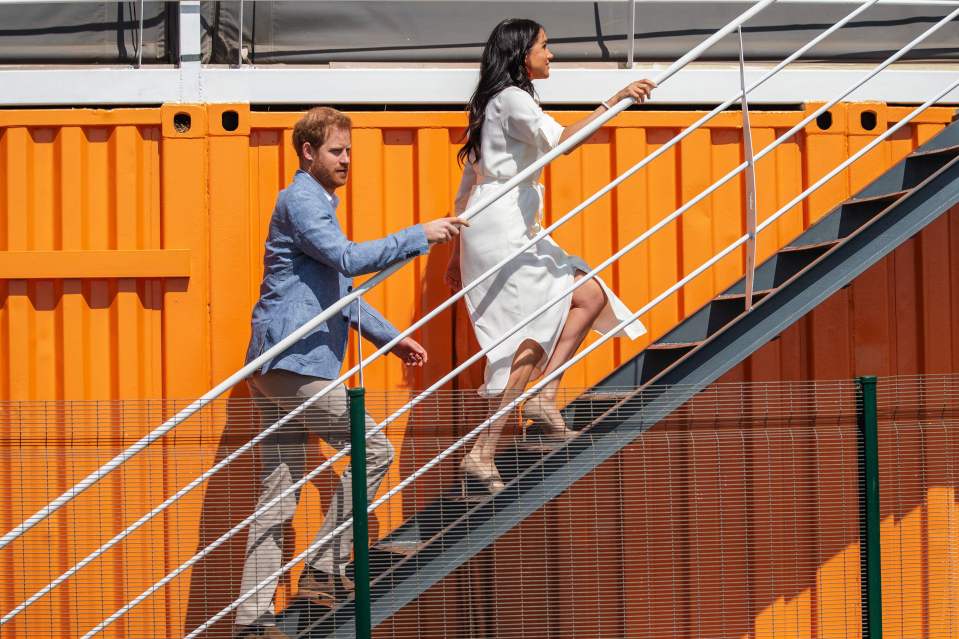  Ever the gentleman Harry let his wife go first up the steps