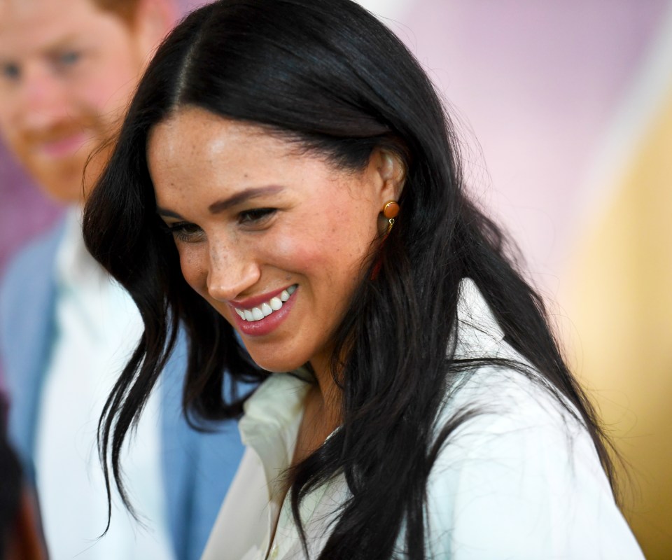  Meghan beamed as they pottered about the township meeting the locals