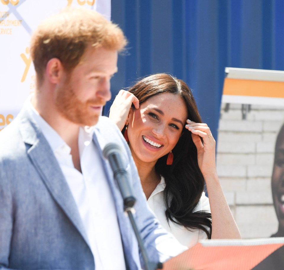  Meg gazed fondly at her husband as he addressed the crowd