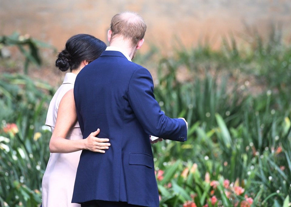  The Duchess put her hand affectionately around her husband's back