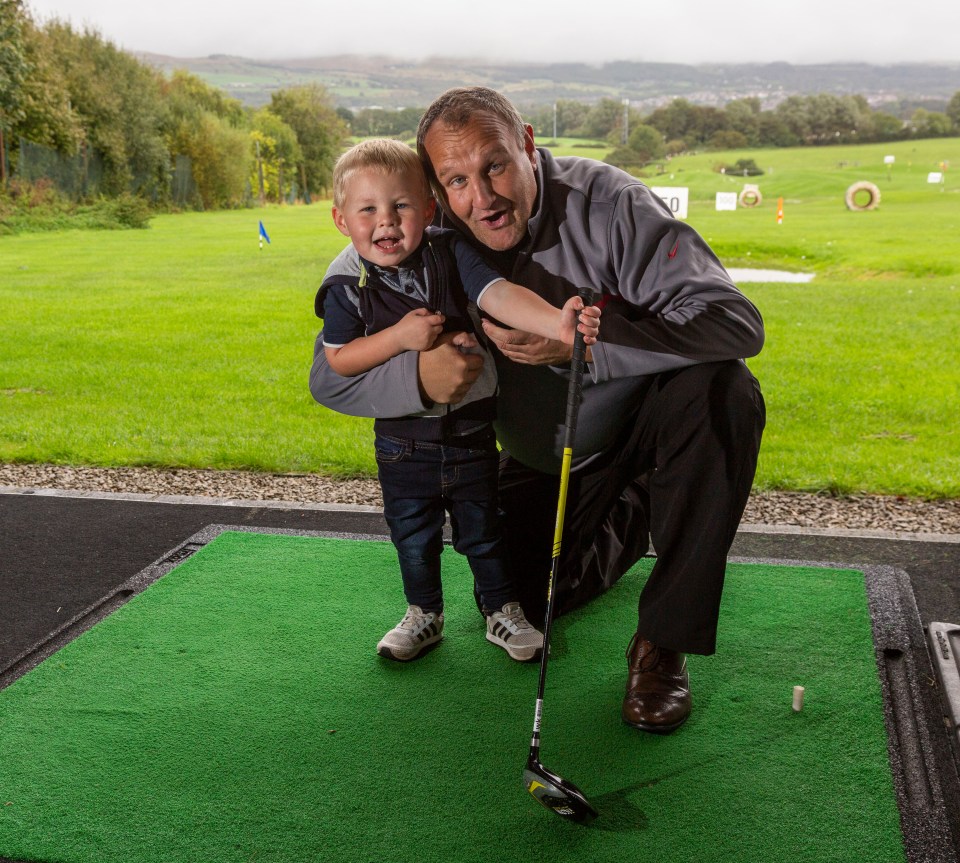  George, 3, on the driving range with granddad Tony Sedgwick, 48