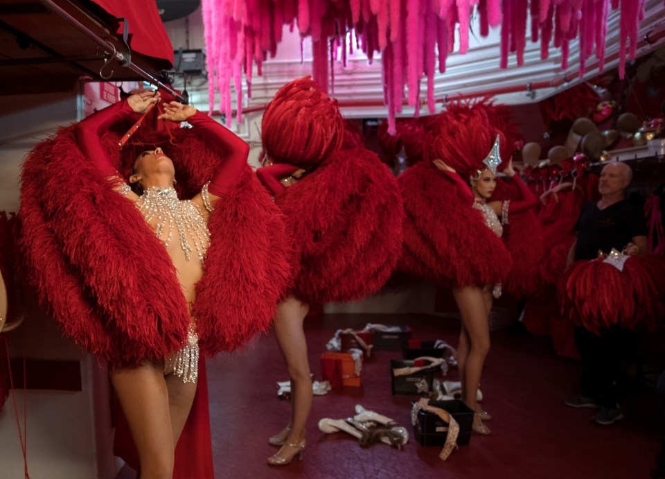  Dancers get ready for the 'red' set in the review, Feerie