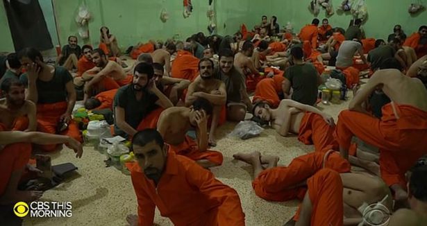  Footage for US network CBS shows 'Jihadi Jack' lying on the floor of a crowded cell at a secret Kurdish prison in northern Syria