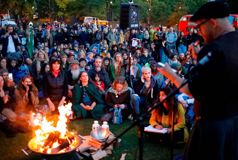  Protesters gather at Marble Arch in London at an opening ceremony to mark the beginning of the International Rebellion on October 6, 2019