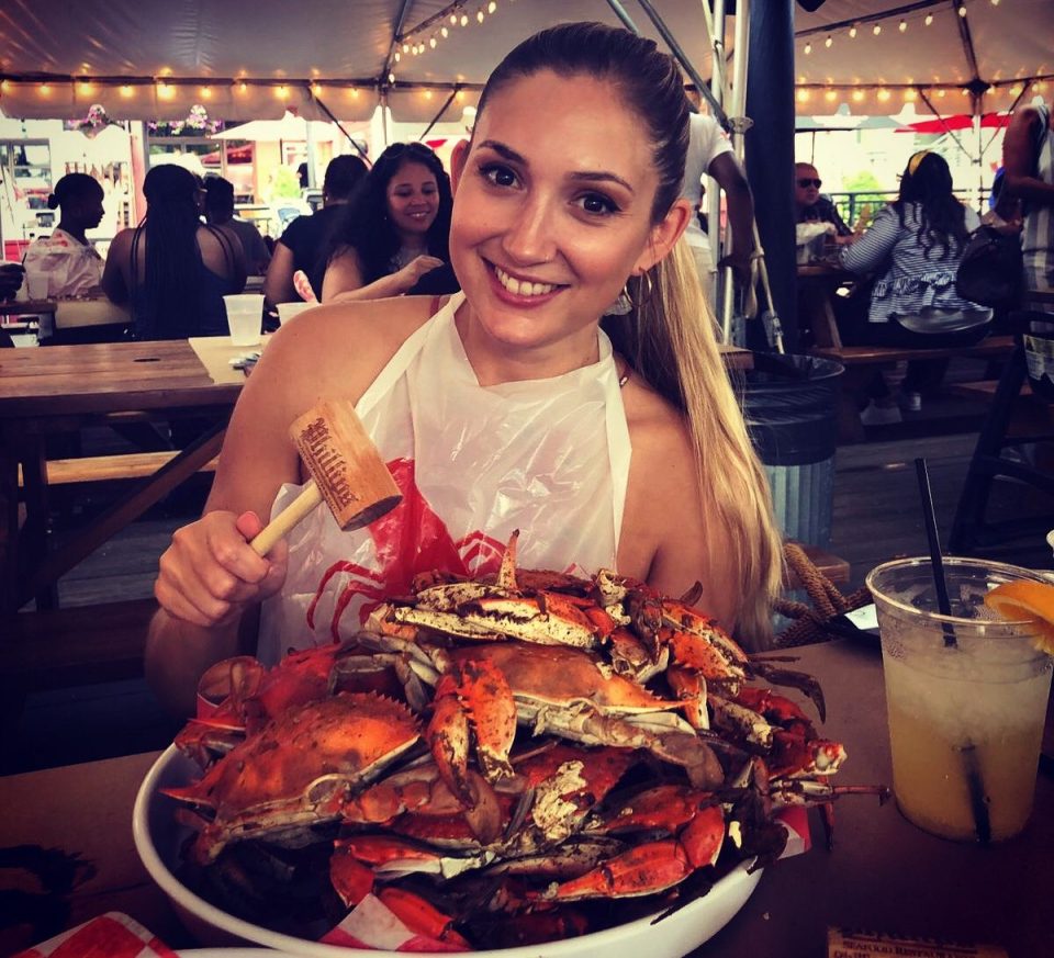  Jessica enjoys a crab dish, one of Baltimore's specialities