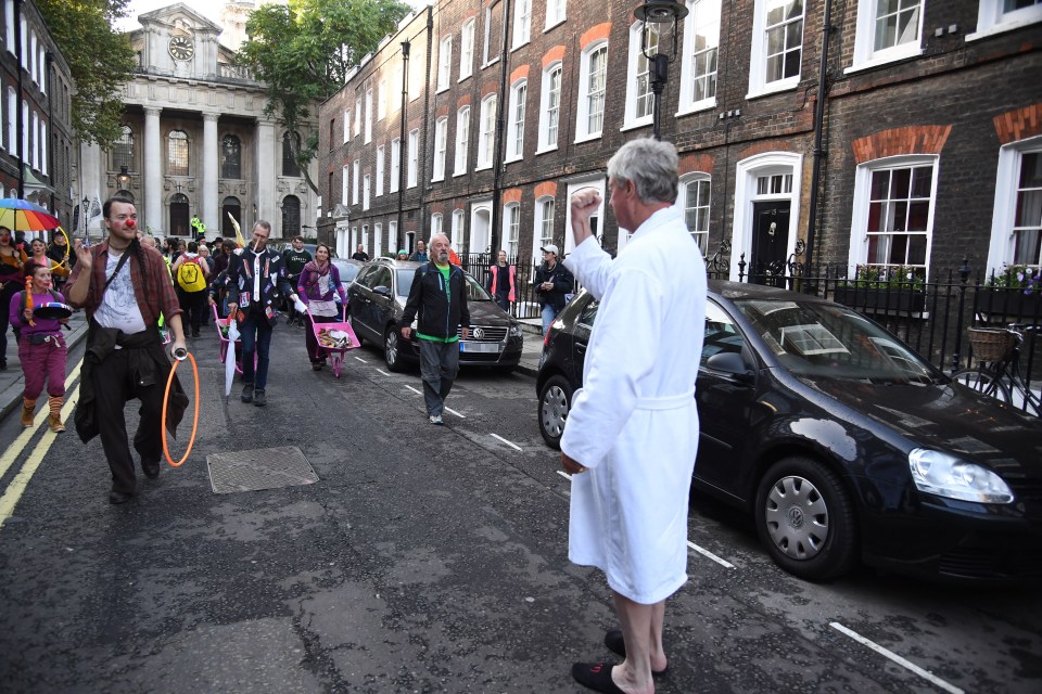  Conservative peer Lord Fraser clashed with Extinction Rebellion protesters after he emerged from his Westminster home in his dressing gown to confront them