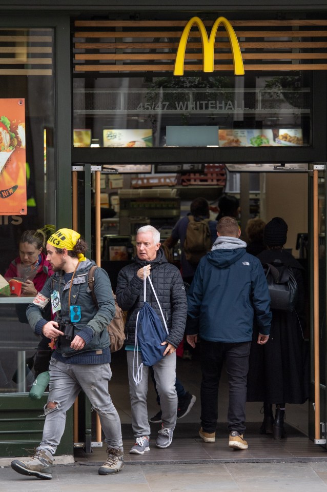  Another protester was seen stepping out of the fast food chain, which boasts that it sells 75 hamburgers every second