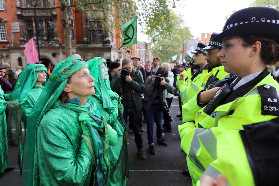  Environmentalists face up to police in Westminster on the second day of protests