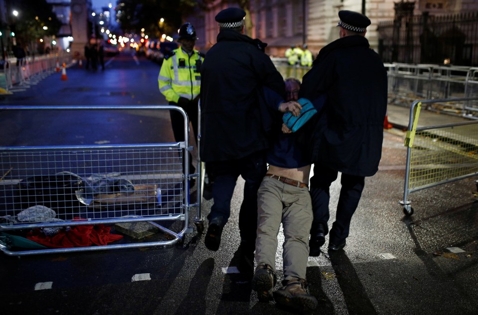  A man gets detained by police in Whitehall last night