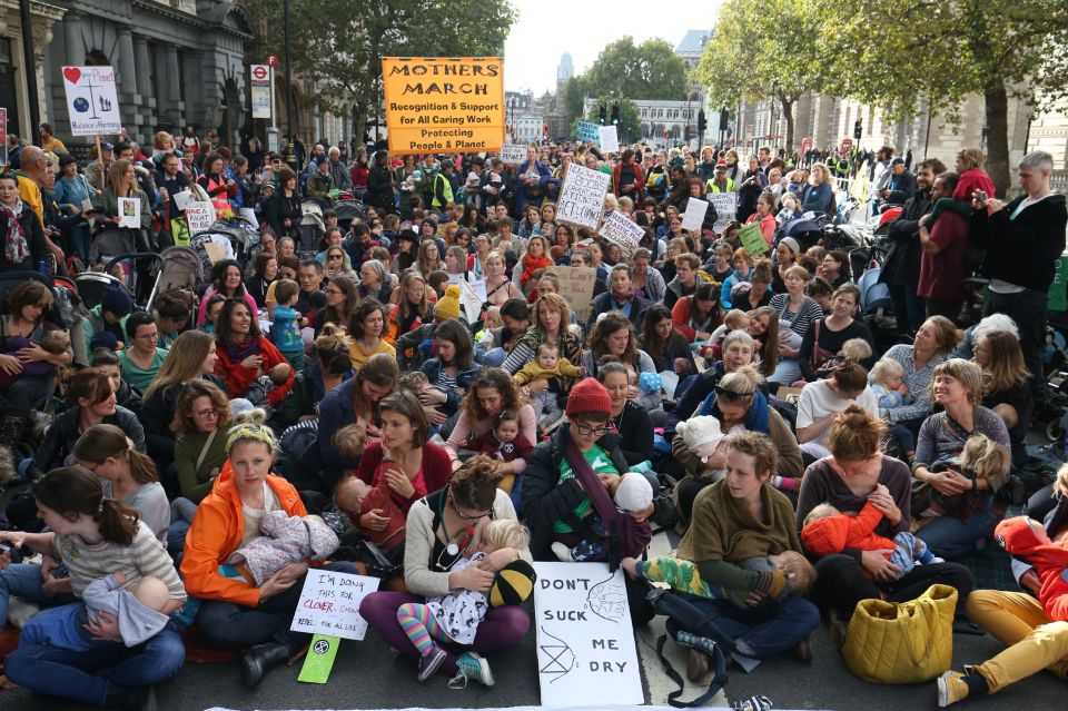  Nursing mothers with their children block Whitehall during the Extinction Rebellion mass 'nurse-in' road blockade