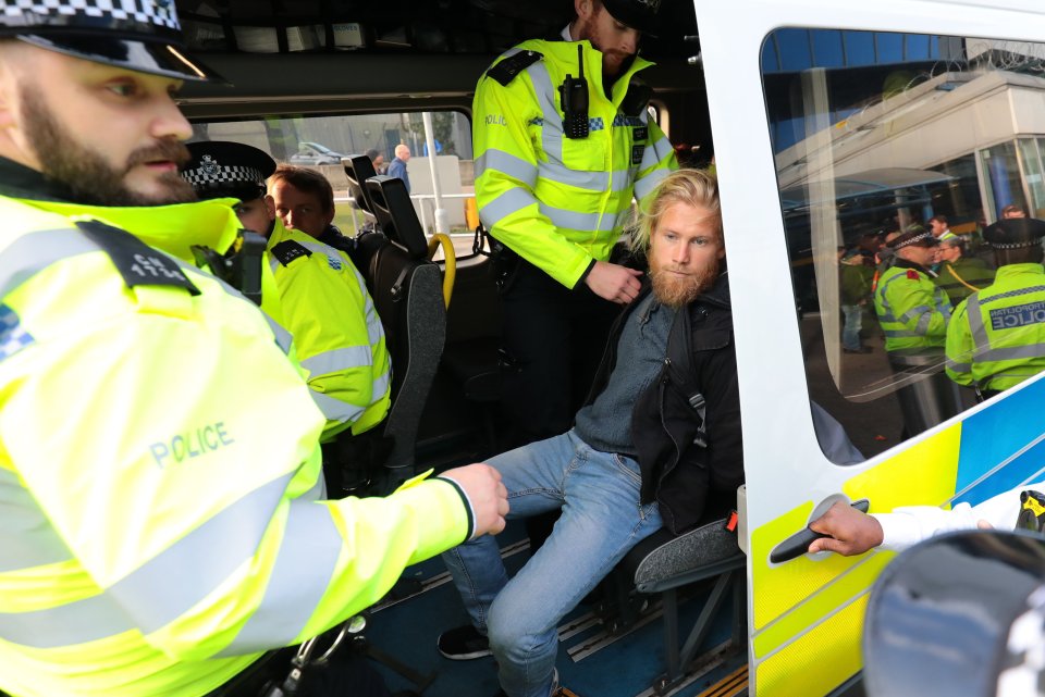  Scores of police officers were stationed outside London City Airport yesterday morning