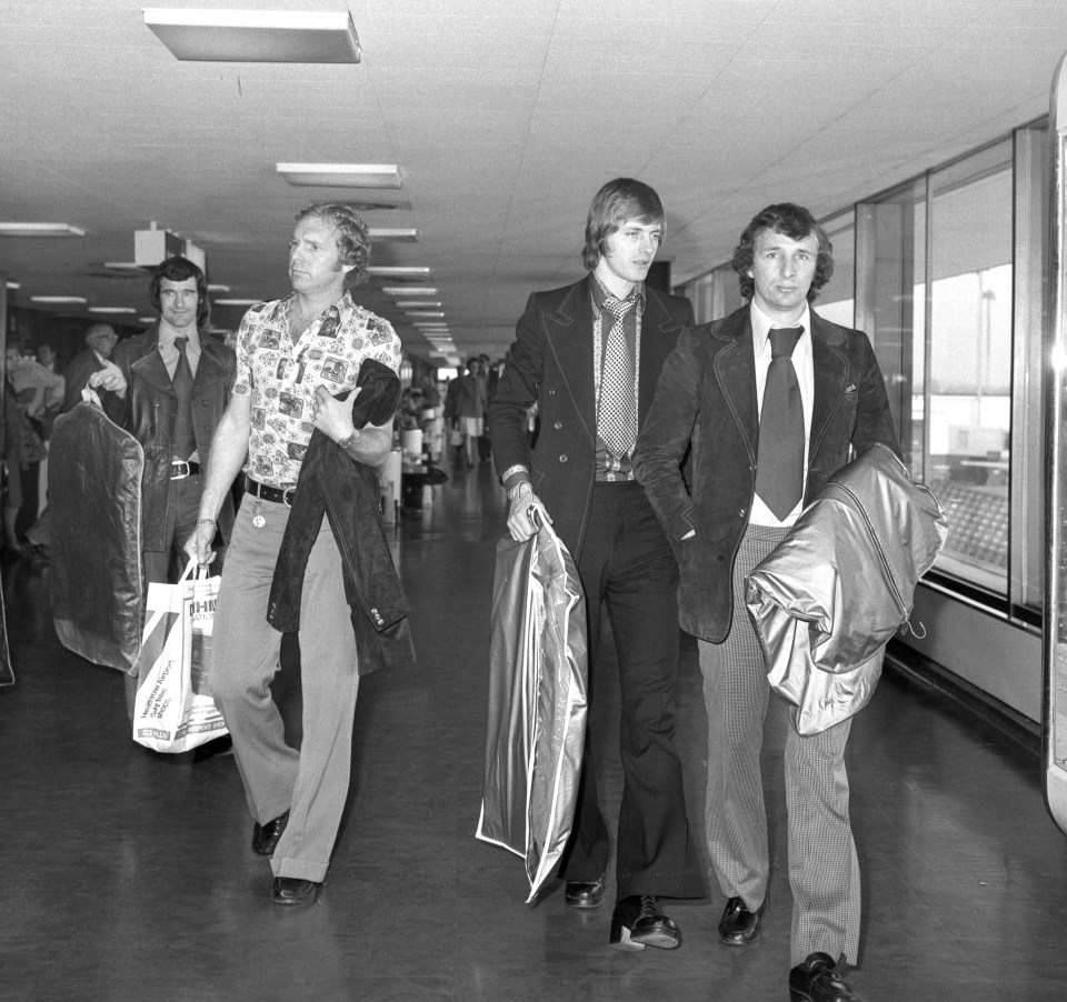  England captain Bobby Moore, left, leaves Heathrow for Prague with Allan Clarke and Mike Summerbee, right